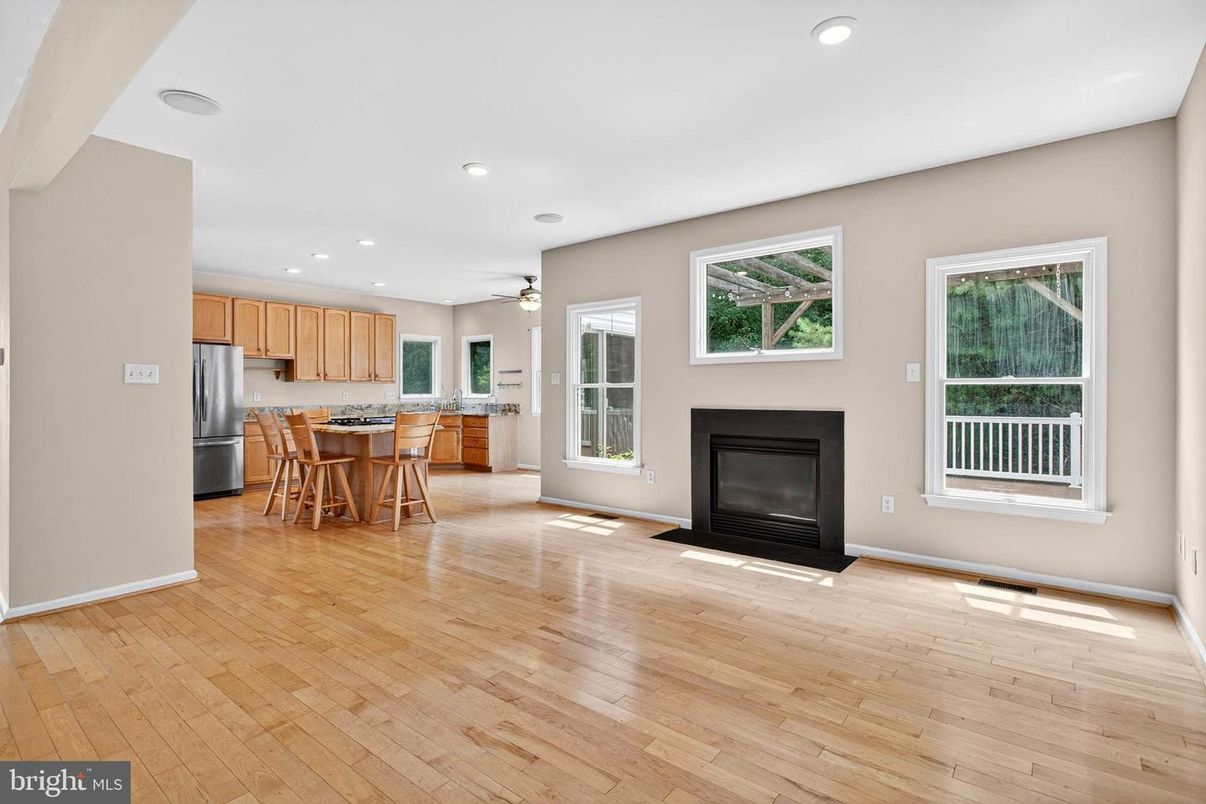 Dining room, Fireplace, Interior, Kitchen, Recessed Lighting, Wood Texture Flooring