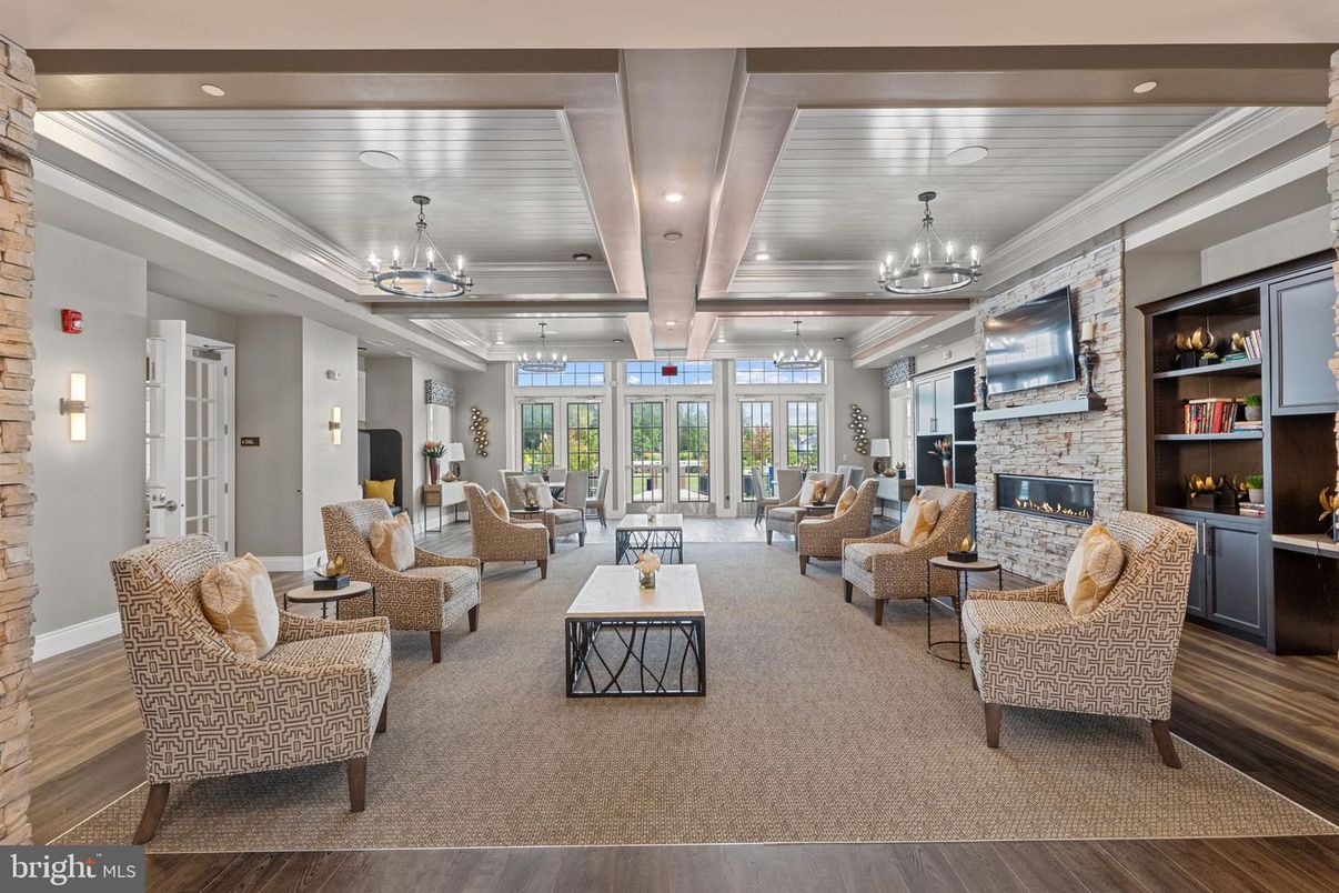 Chandelier, Fireplace, Interior, Living room, Recessed Lighting, Stone Walls, Wood Texture Flooring