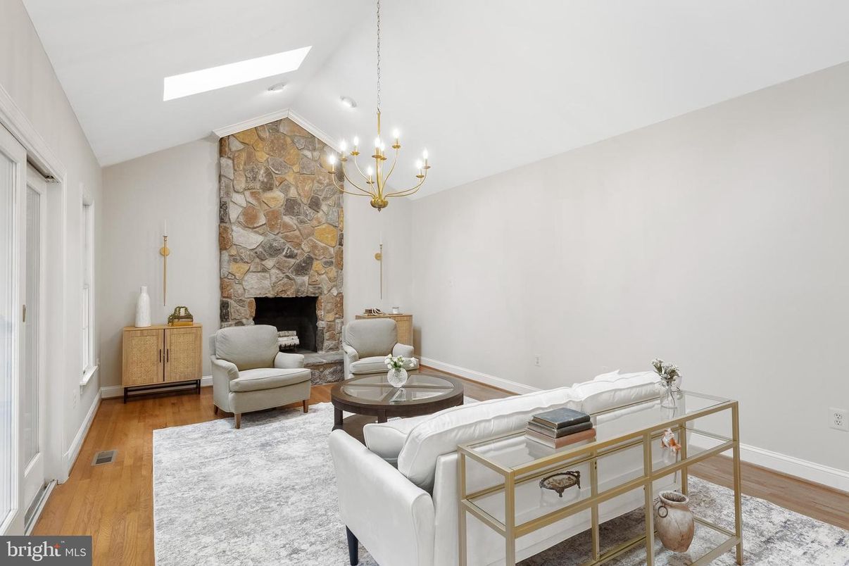 Fireplace, Interior, Living room, Recessed Lighting, Stone Walls, Wood Texture Flooring