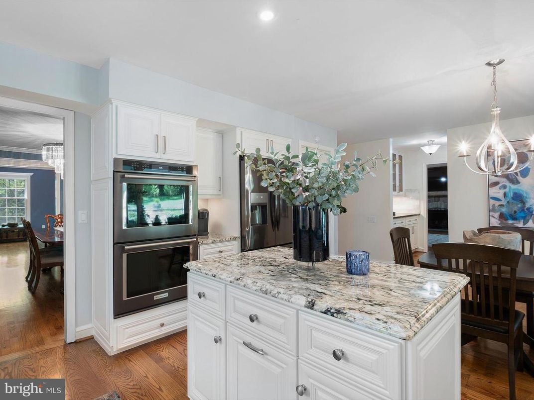 Chandelier, Dining room, Interior, Kitchen, Pendant Lights, Recessed Lighting, Stainless Steel Appliances, Wood Texture Flooring
