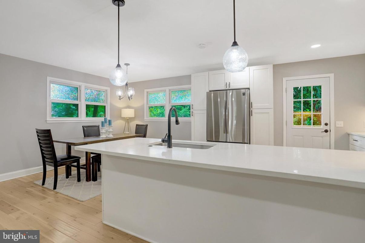 Dining room, Interior, Kitchen, Pendant Lights, Recessed Lighting, Stainless Steel Appliances, Wood Texture Flooring