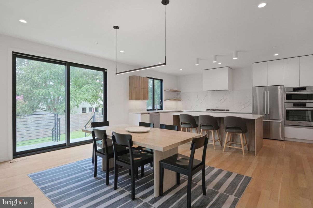 Dining room, Interior, Kitchen, Marble Walls, Pendant Lights, Recessed Lighting, Stainless Steel Appliances, Wood Texture Flooring