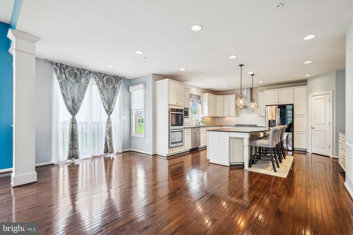 Dining room, Interior, Kitchen, Pendant Lights, Recessed Lighting, Stainless Steel Appliances, Wood Texture Flooring