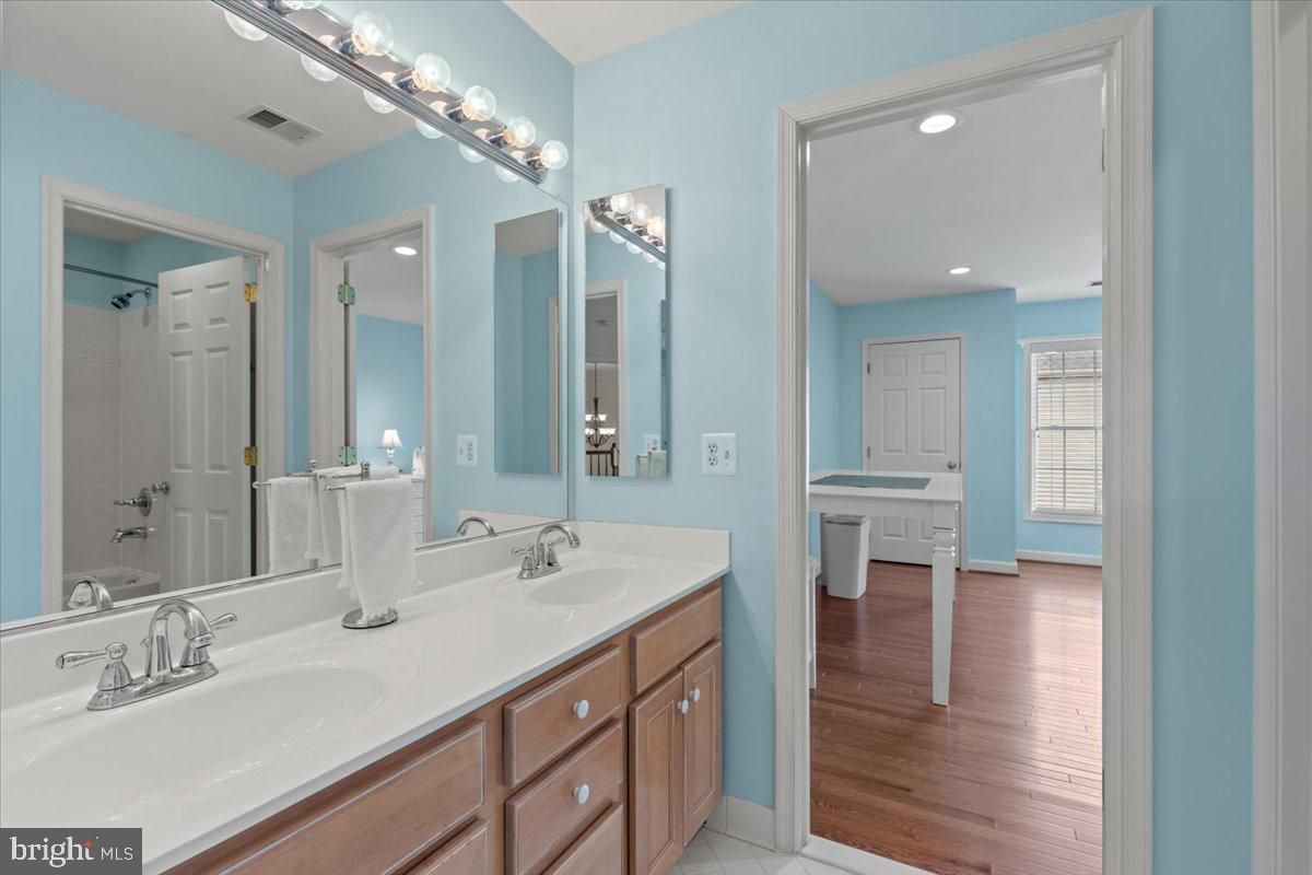 Bathroom, Dual Sink Vanities, Interior, Recessed Lighting, Wood Texture Flooring