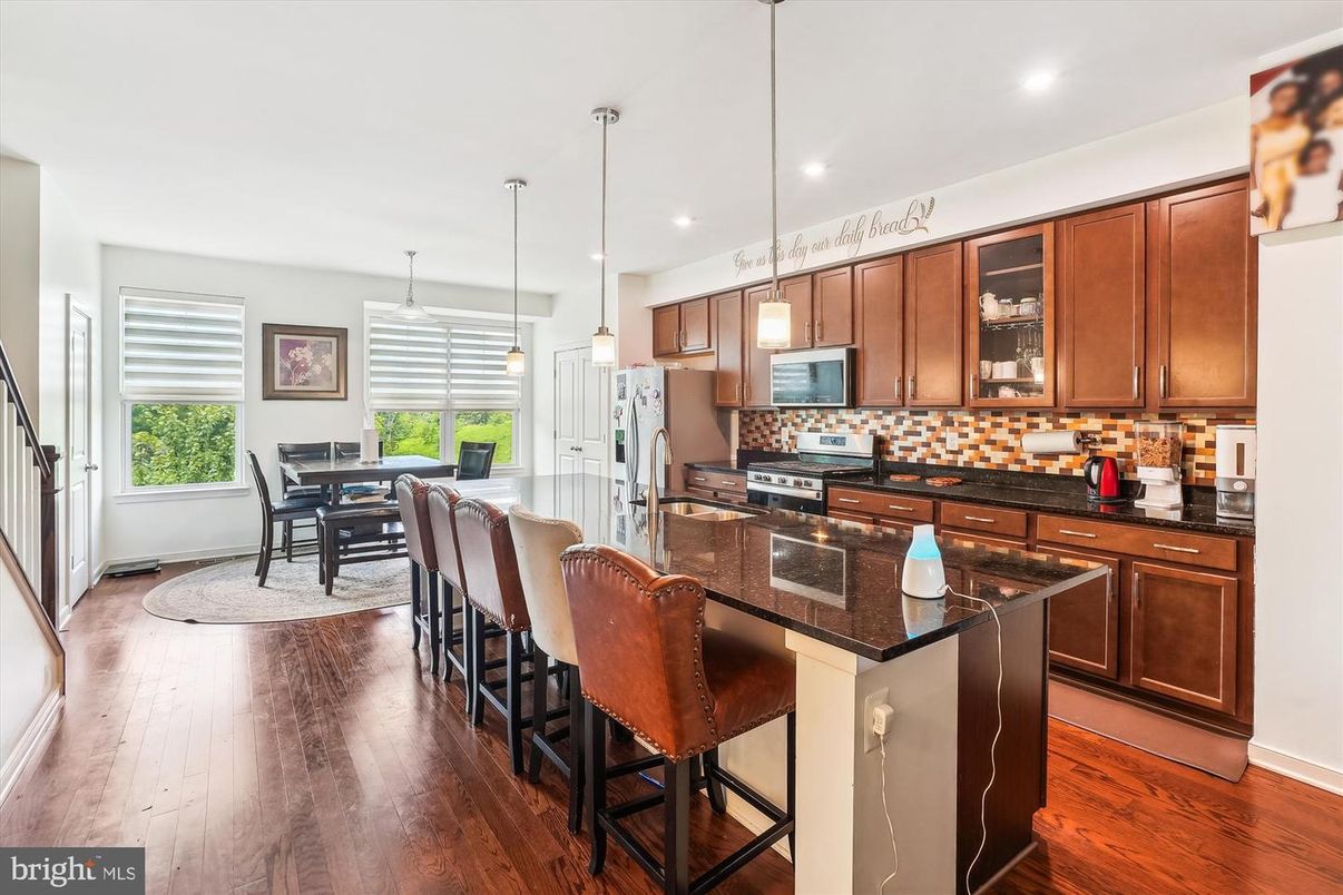 Dining room, Interior, Kitchen, Pendant Lights, Recessed Lighting, Stainless Steel Appliances, Wood Texture Flooring