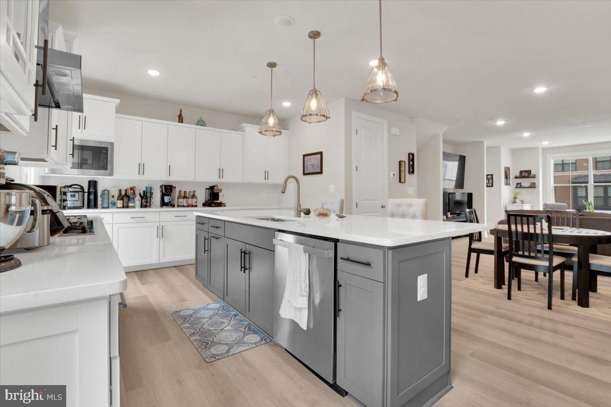 Dining room, Interior, Kitchen, Pendant Lights, Recessed Lighting, Stainless Steel Appliances, Wood Texture Flooring