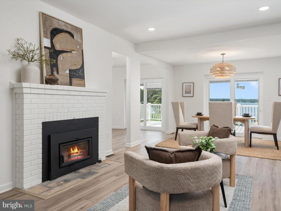 Chandelier, Dining room, Fireplace, Interior, Living room, Recessed Lighting, Water, Wood Texture Flooring