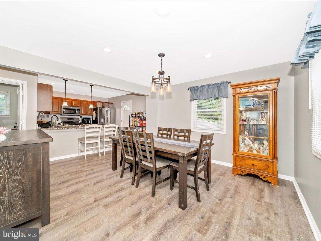 Dining room, Interior, Kitchen, Pendant Lights, Recessed Lighting, Stainless Steel Appliances, Wood Texture Flooring