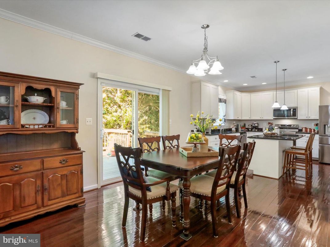 Chandelier, Dining room, Interior, Kitchen, Pendant Lights, Recessed Lighting, Stainless Steel Appliances, Wood Texture Flooring