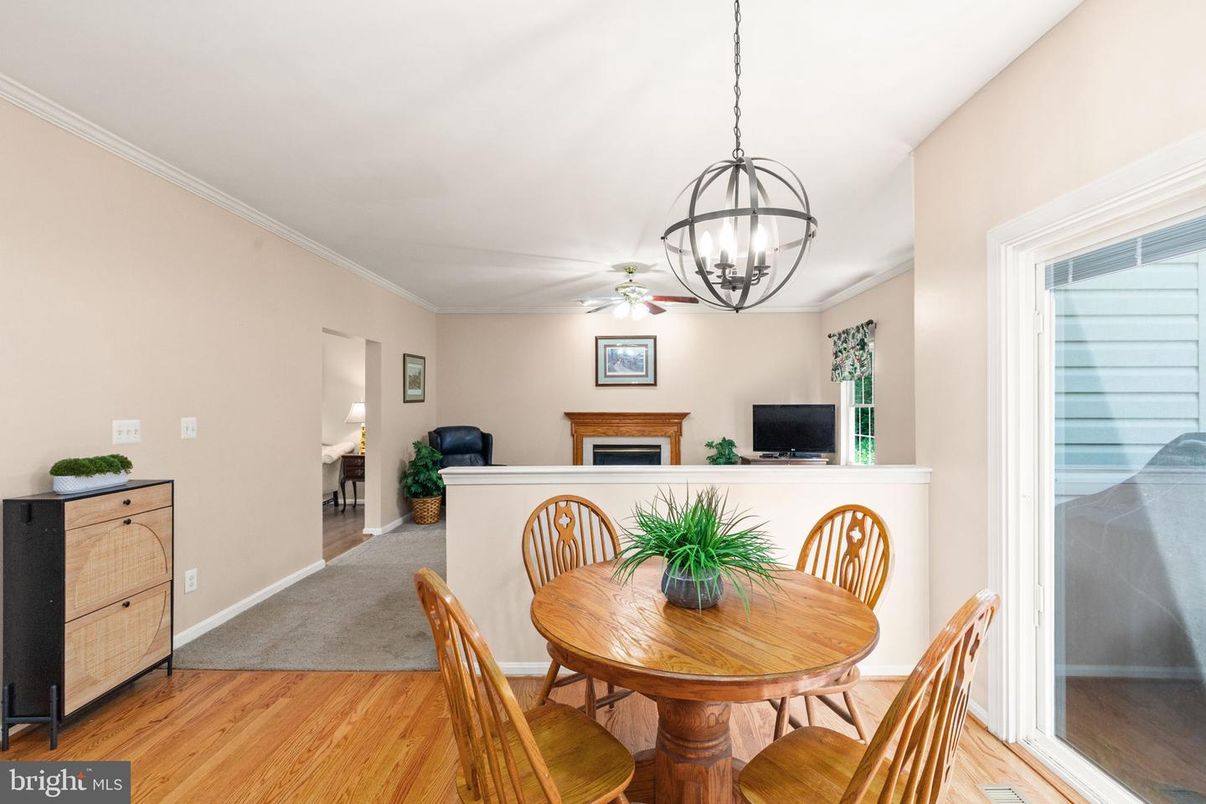 Chandelier, Dining room, Fireplace, Interior, Pendant Lights, Wood Texture Flooring