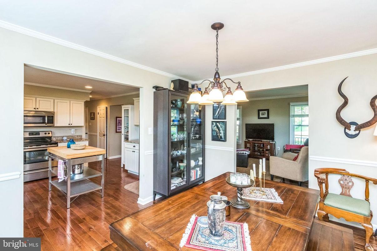Chandelier, Dining room, Interior, Kitchen, Living room, Stainless Steel Appliances, Wood Texture Flooring