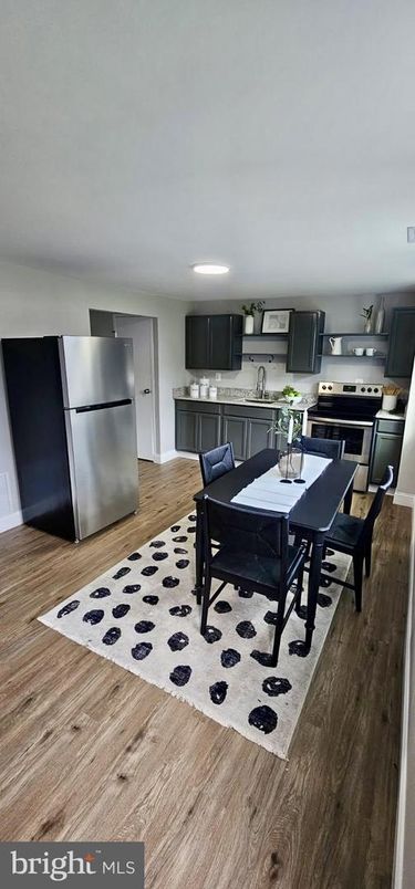 Dining room, Interior, Kitchen, Recessed Lighting, Stainless Steel Appliances, Wood Texture Flooring