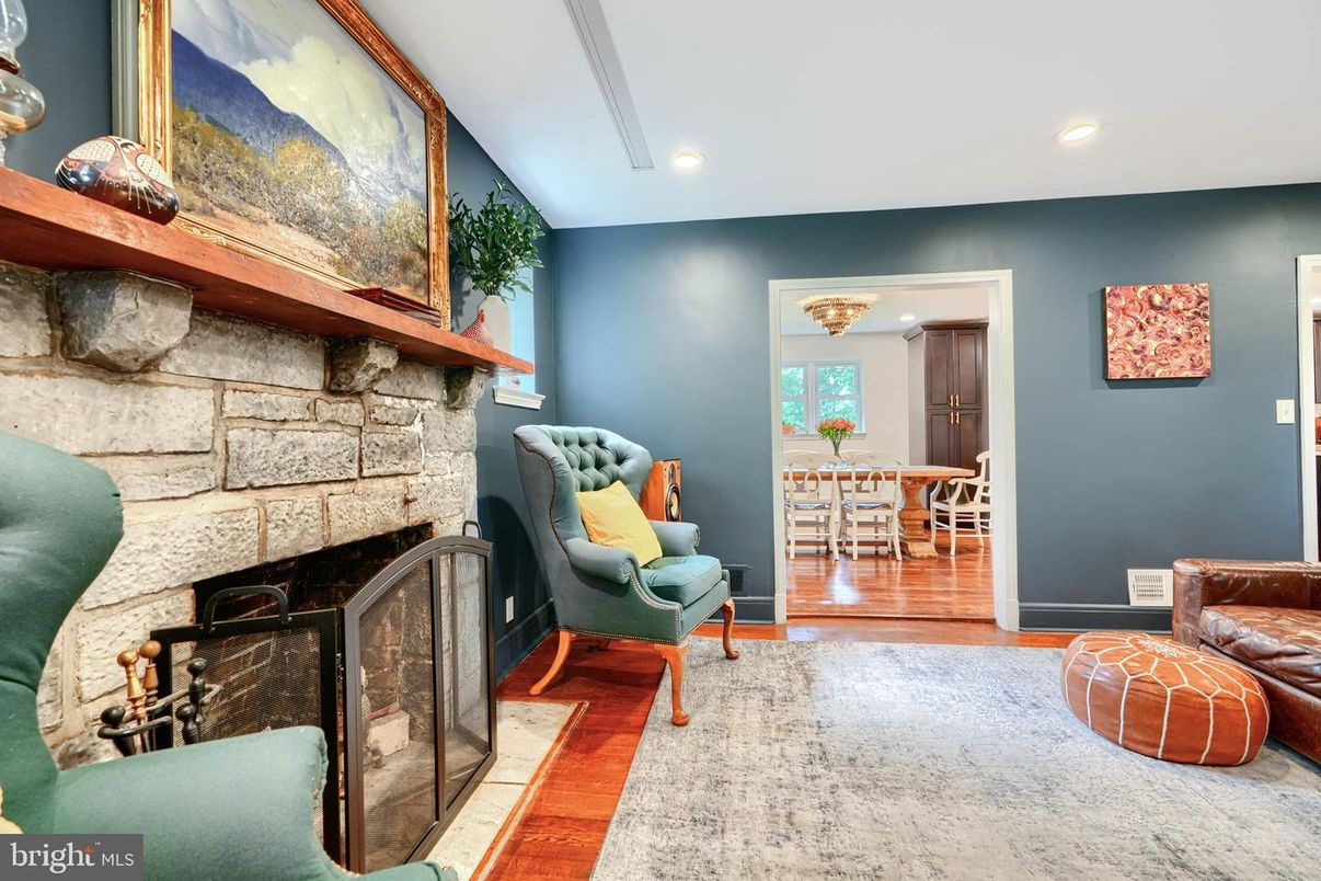 Dining room, Fireplace, Interior, Recessed Lighting, Stone Walls, Wood Texture Flooring