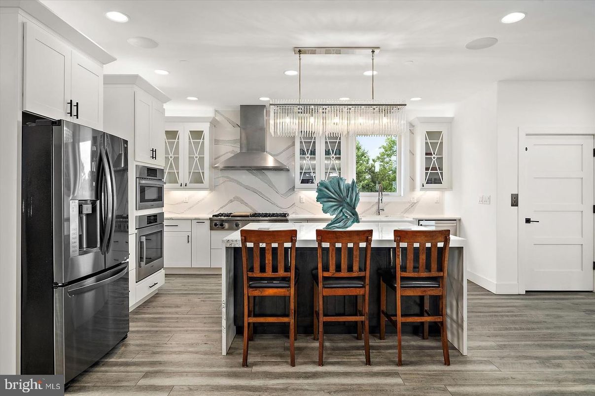 Chandelier, Interior, Kitchen, Marble Walls, Recessed Lighting, Stainless Steel Appliances, Wood Texture Flooring
