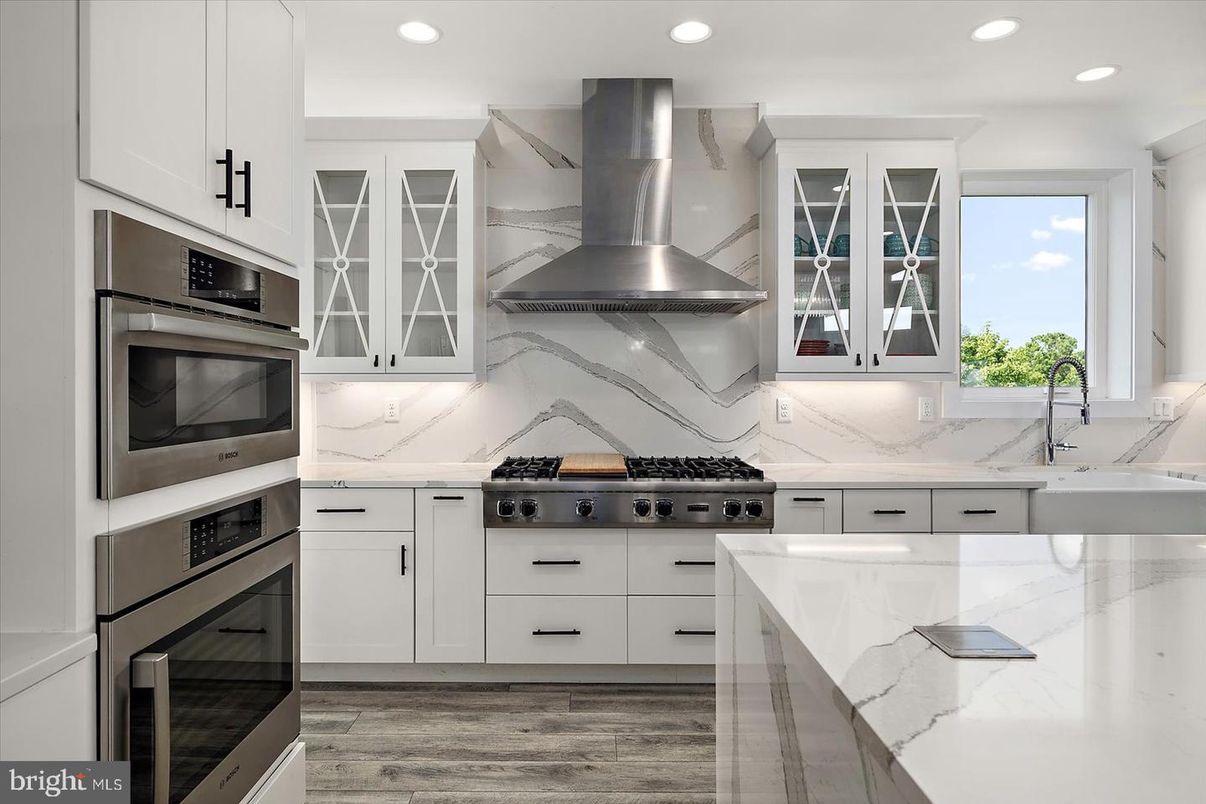 Interior, Kitchen, Marble Walls, Recessed Lighting, Stainless Steel Appliances, Wood Texture Flooring
