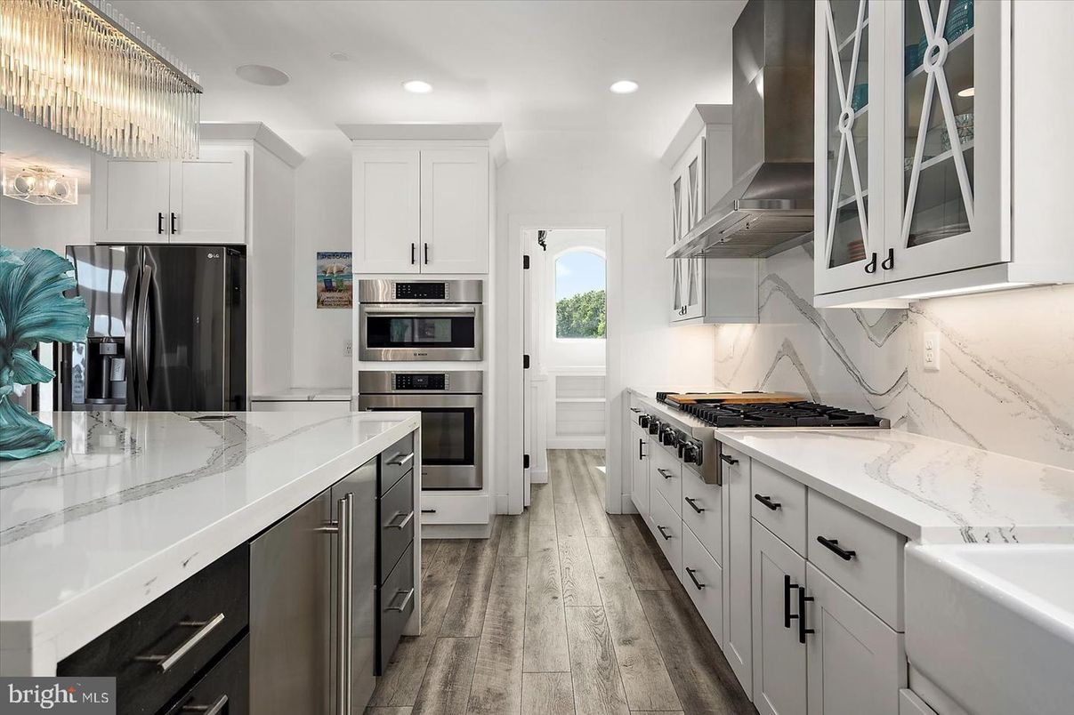 Chandelier, Interior, Kitchen, Marble Walls, Recessed Lighting, Stainless Steel Appliances, Wood Texture Flooring