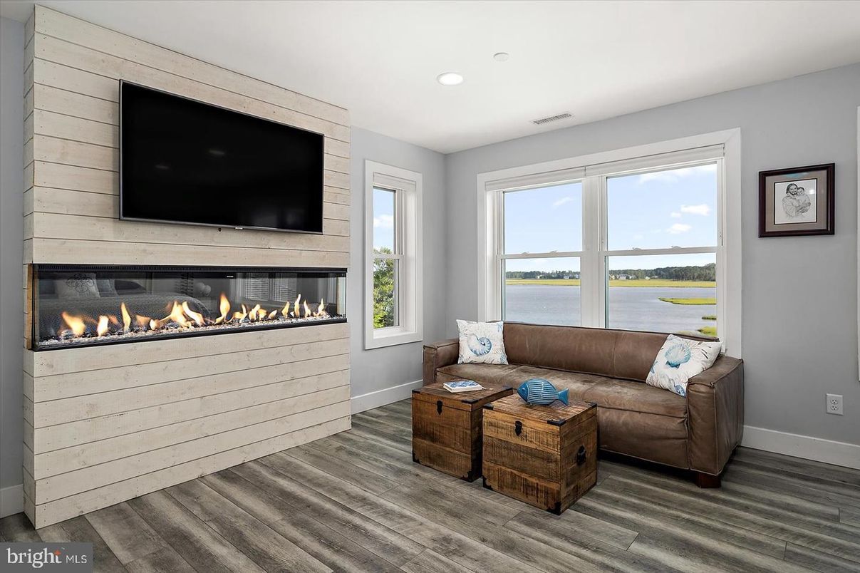 Fireplace, Interior, Living room, Recessed Lighting, Water, Wood Texture Flooring