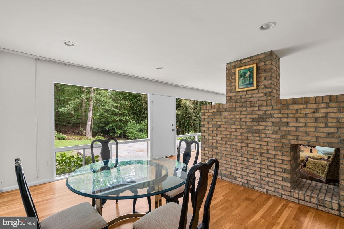 Dining room, Fireplace, Interior, Recessed Lighting, Stone Walls, Wood Texture Flooring