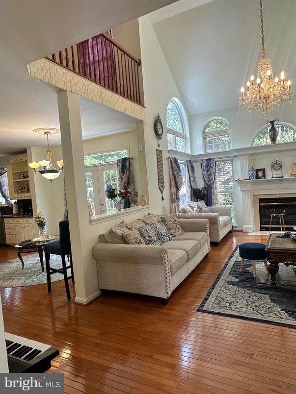 Chandelier, Fireplace, Interior, Living room, Piano, Wood Texture Flooring