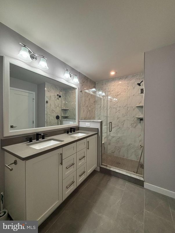 Bathroom, Dual Sink Vanities, Glass Shower, Interior, Marble Walls, Recessed Lighting