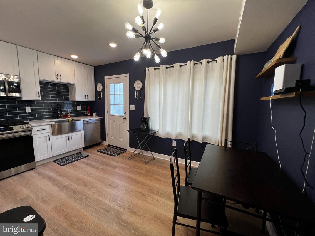 Dining room, Interior, Kitchen, Pendant Lights, Recessed Lighting, Stainless Steel Appliances, Wood Texture Flooring
