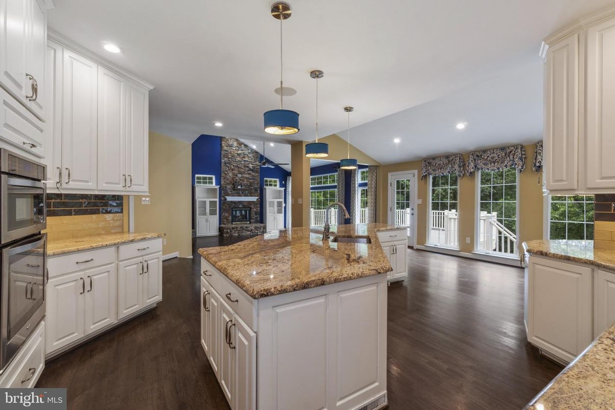 Fireplace, Interior, Kitchen, Pendant Lights, Recessed Lighting, Stainless Steel Appliances, Wood Texture Flooring