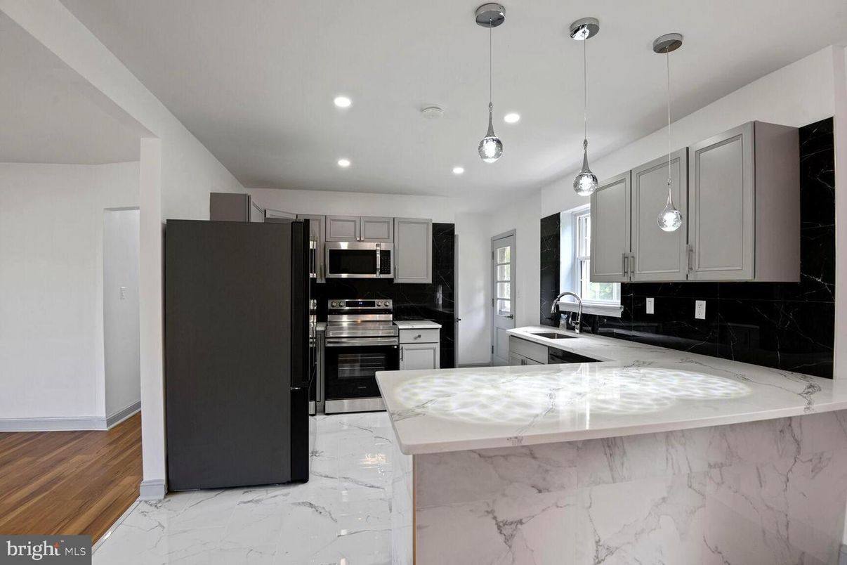 Interior, Kitchen, Marble, Pendant Lights, Recessed Lighting, Stainless Steel Appliances, Wood Texture Flooring
