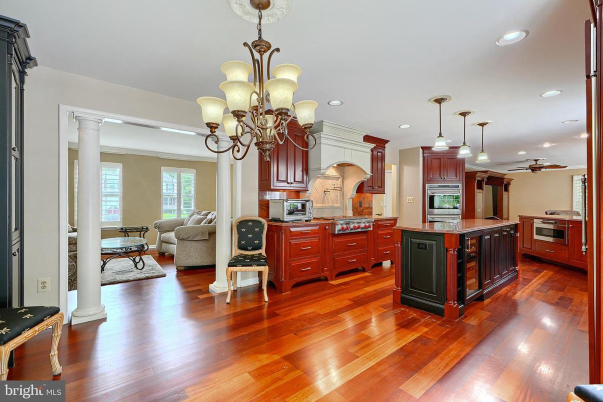 Chandelier, Interior, Kitchen, Living room, Pendant Lights, Recessed Lighting, Stainless Steel Appliances, Wood Texture Flooring