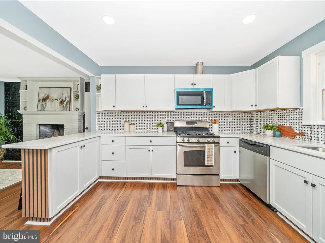 Fireplace, Interior, Kitchen, Recessed Lighting, Stainless Steel Appliances, Wood Texture Flooring