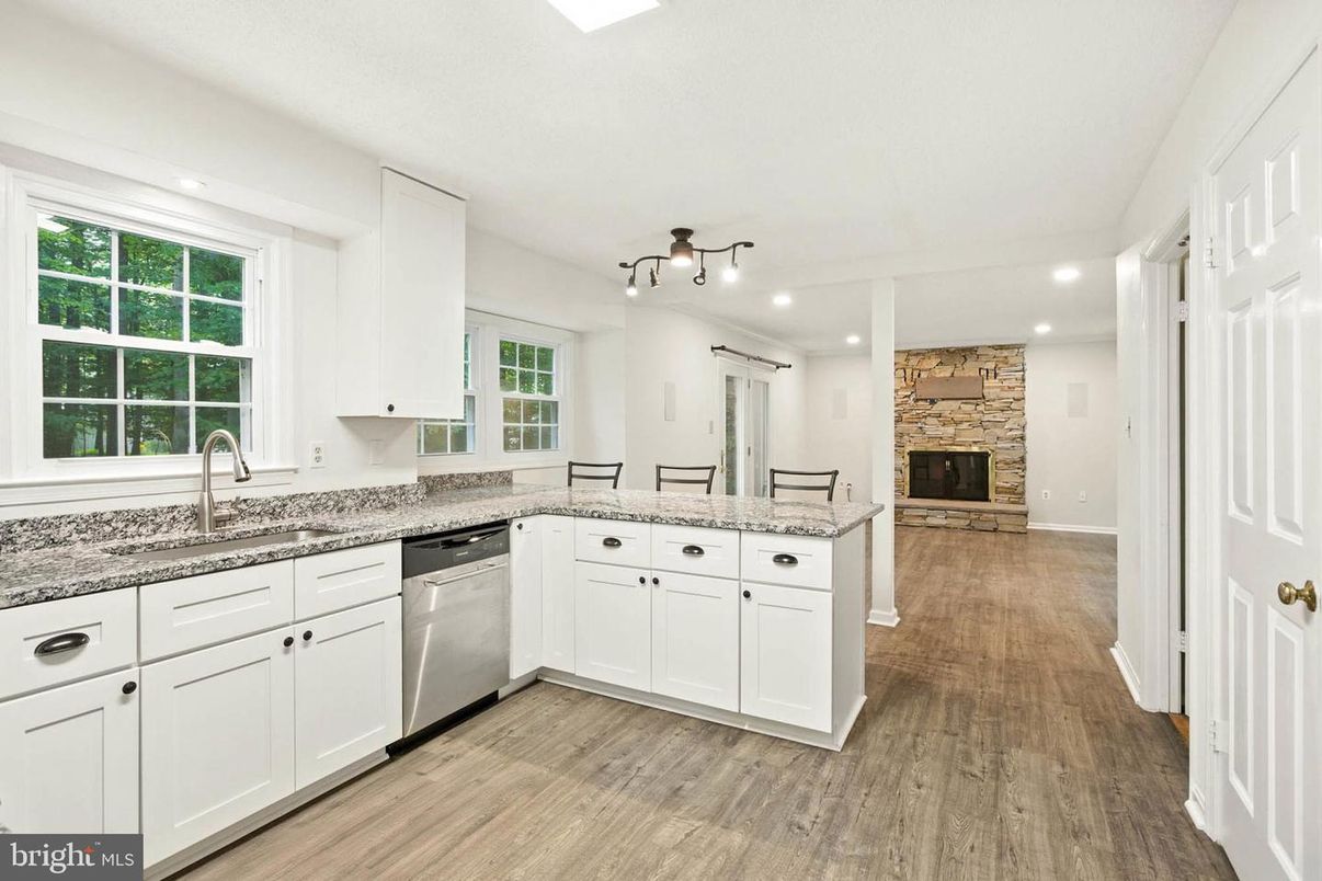 Fireplace, Interior, Kitchen, Recessed Lighting, Stone Walls, Wood Texture Flooring