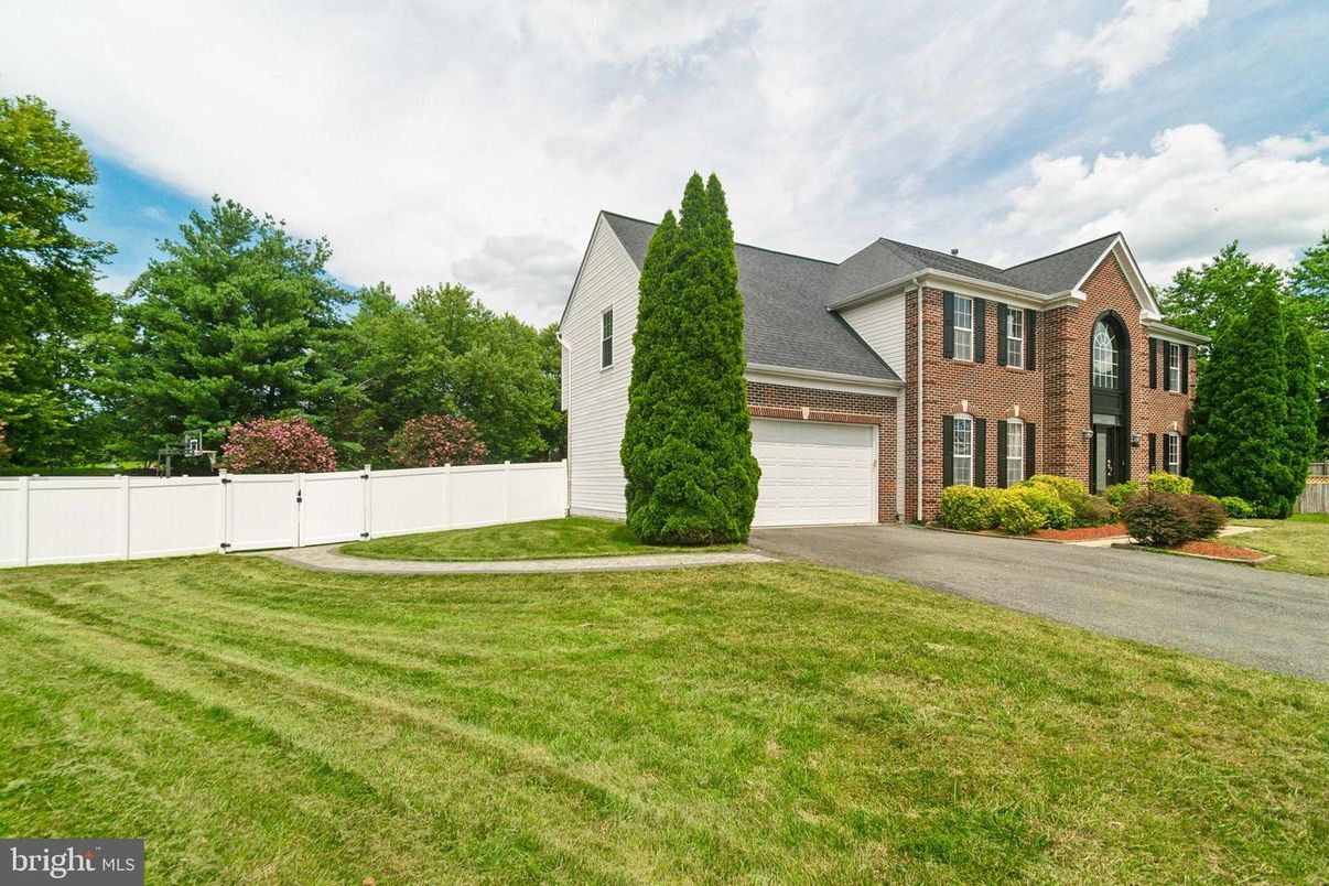 Attached, Backyard, Exterior, Facade, Brick Facade, Brick Traditional