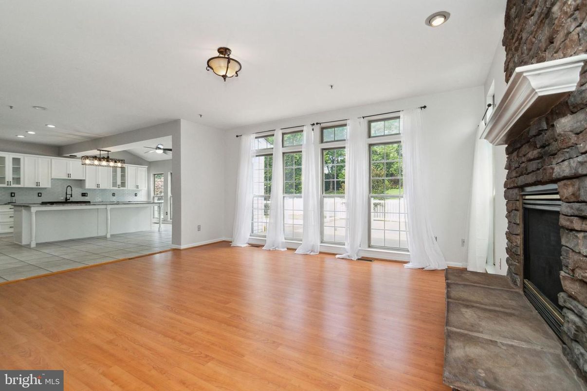Empty room, Fireplace, Interior, Kitchen, Recessed Lighting, Wood Texture Flooring