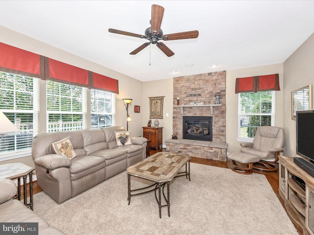 Fireplace, Interior, Living room, Recessed Lighting, Stone Walls, Wood Texture Flooring