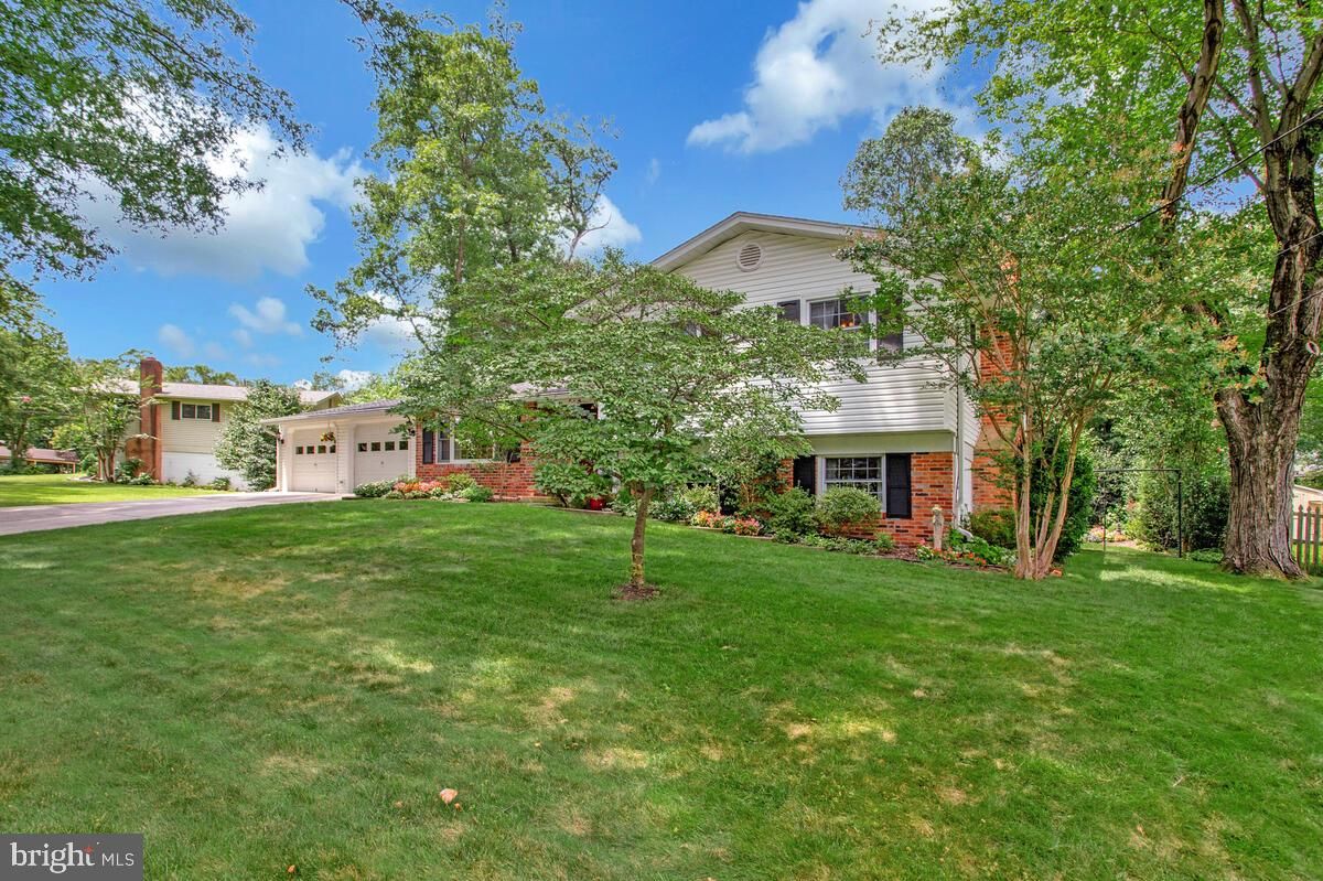 Attached, Backyard, Exterior, Facade, Brick Facade, Raised Ranch