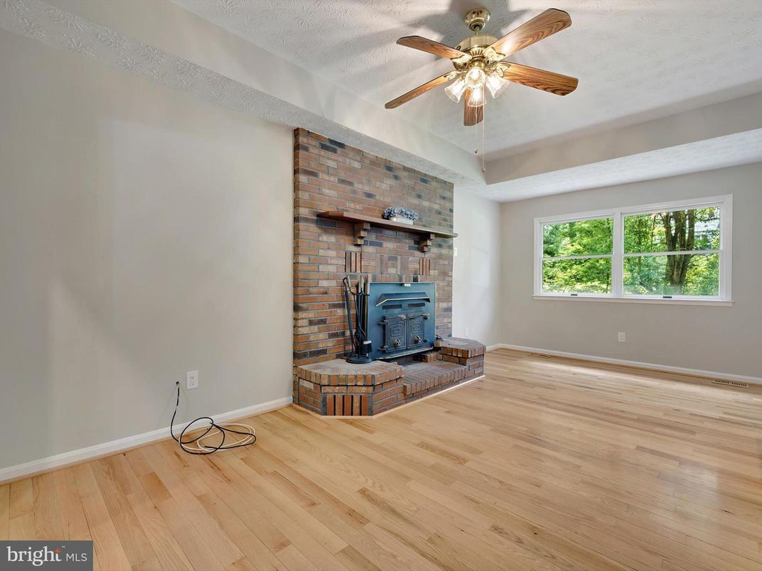 Empty room, Fireplace, Interior, Stone Walls, Wood Texture Flooring