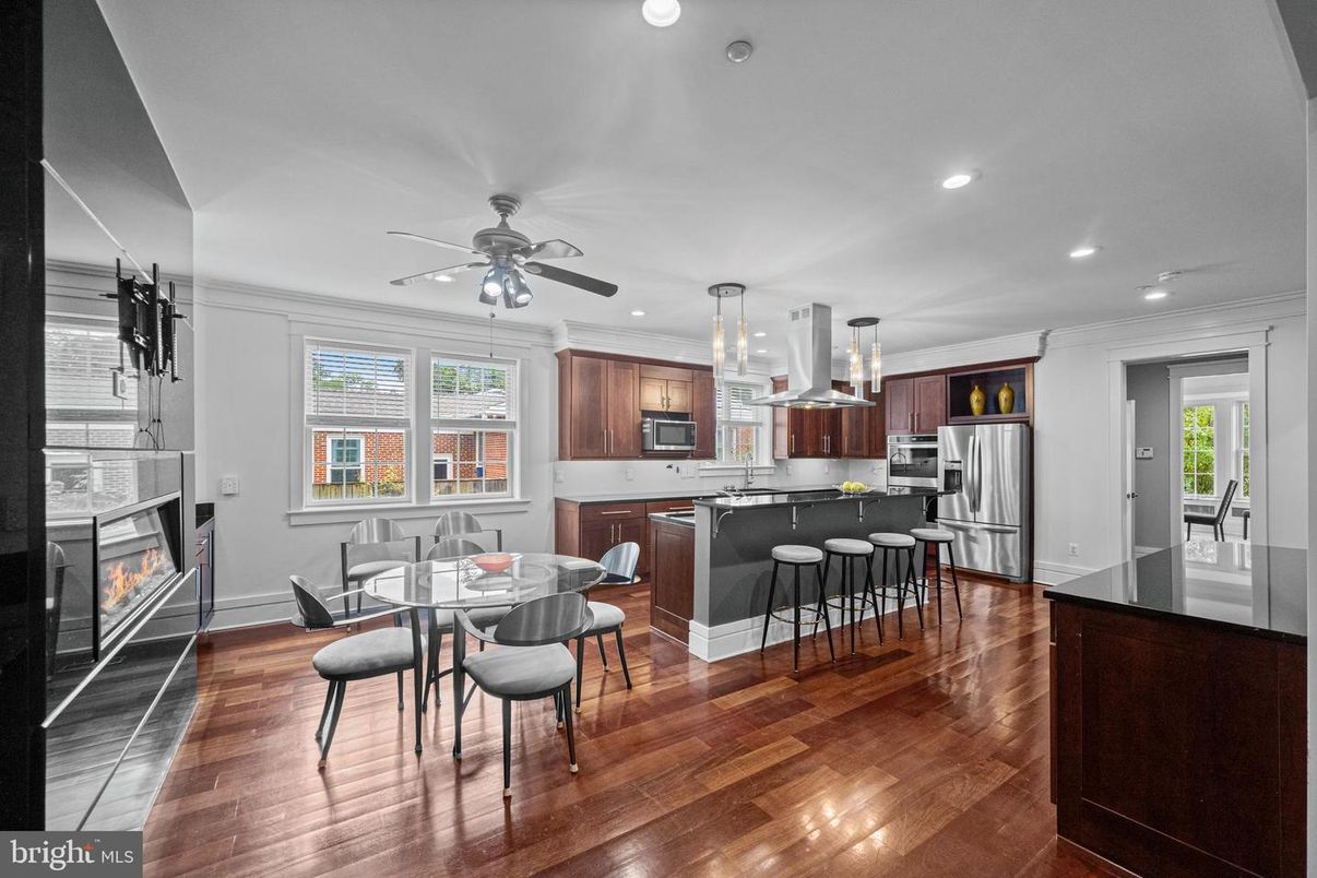 Dining room, Fireplace, Interior, Kitchen, Pendant Lights, Recessed Lighting, Stainless Steel Appliances, Wood Texture Flooring