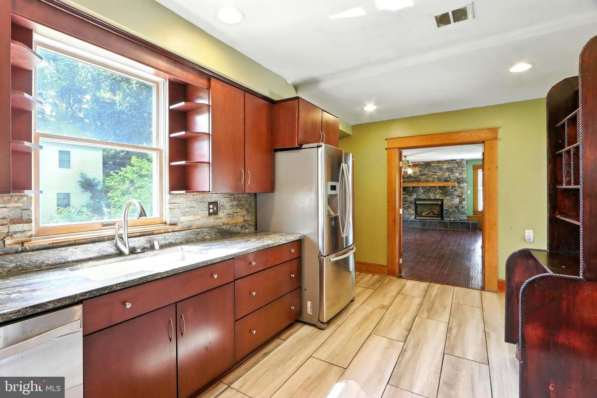 Fireplace, Interior, Kitchen, Recessed Lighting, Stainless Steel Appliances, Wood Texture Flooring