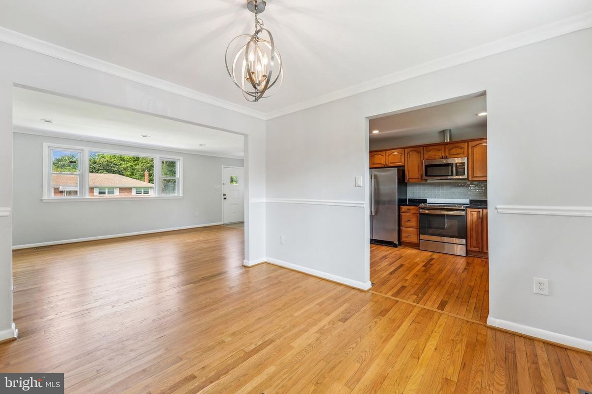 Empty room, Interior, Kitchen, Pendant Lights, Recessed Lighting, Stainless Steel Appliances, Wood Texture Flooring