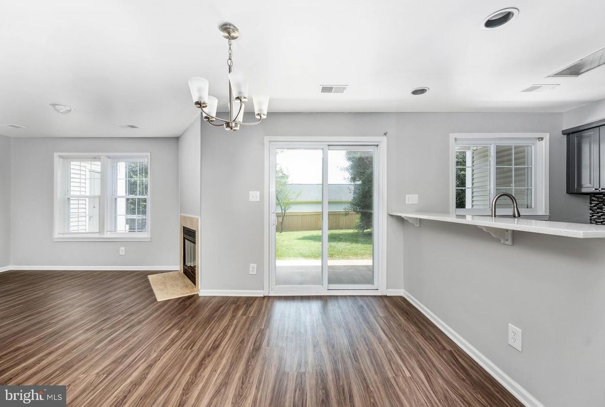 Chandelier, Empty room, Fireplace, Interior, Recessed Lighting, Wood Texture Flooring