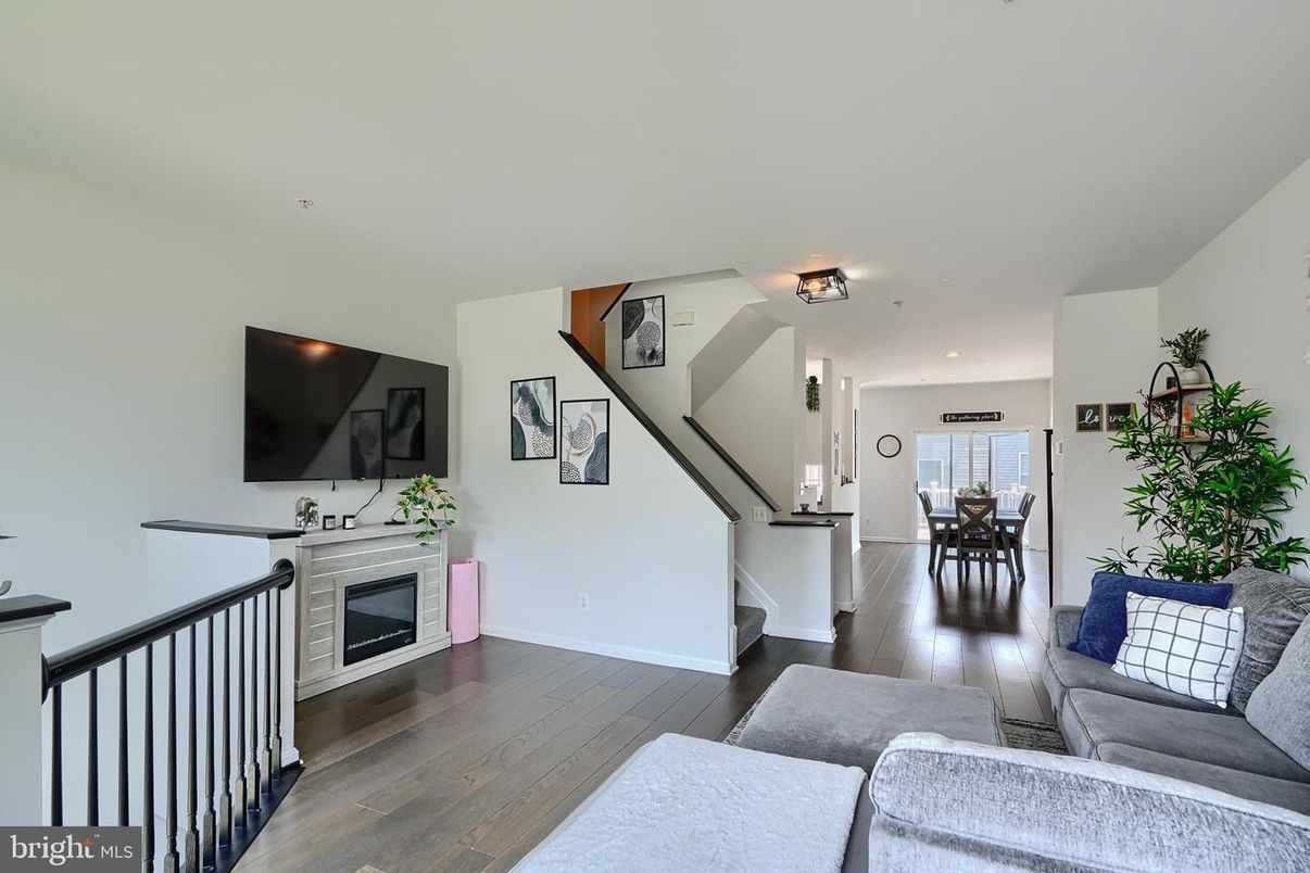 Dining room, Fireplace, Interior, Living room, Recessed Lighting, Wood Texture Flooring