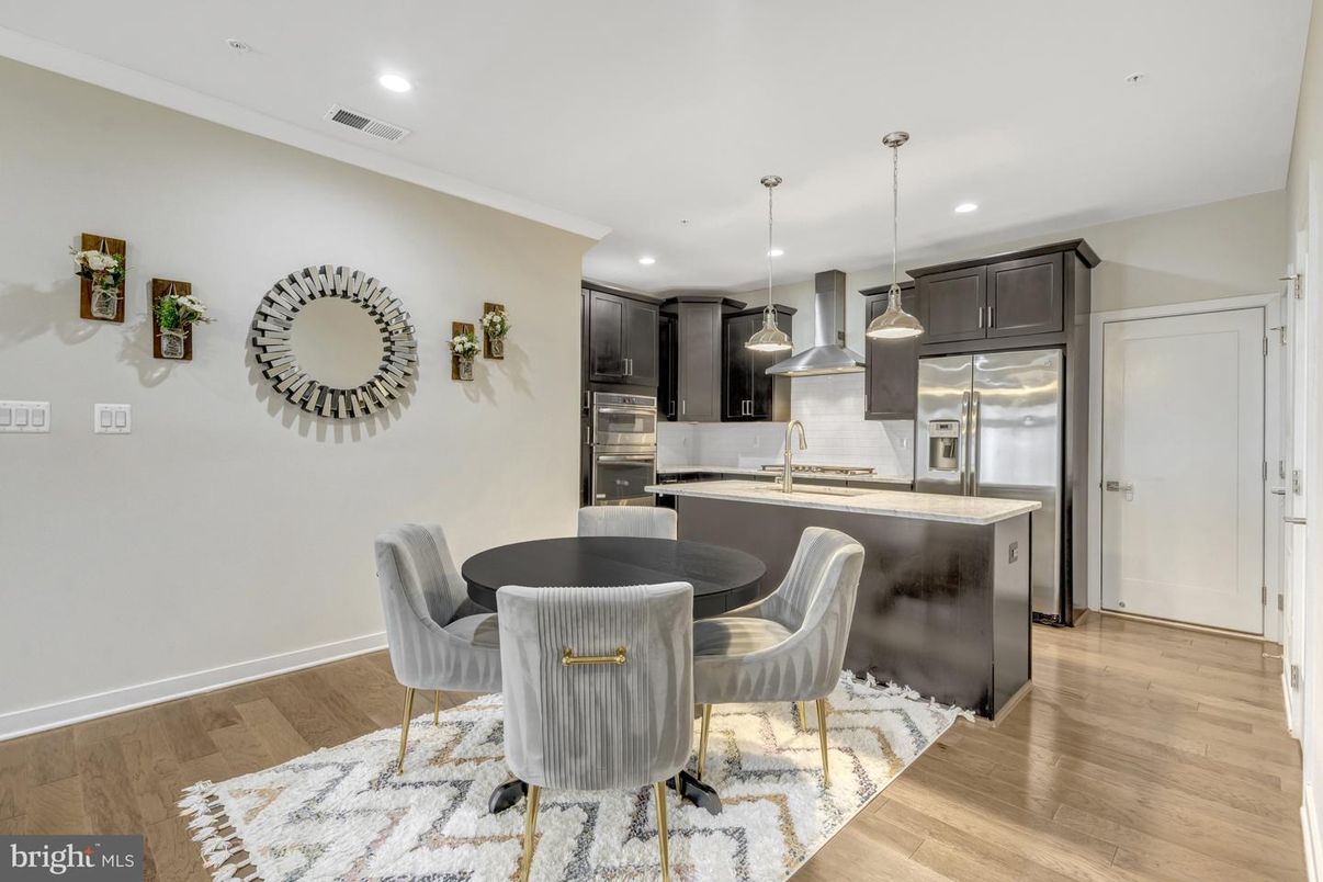 Dining room, Interior, Kitchen, Pendant Lights, Recessed Lighting, Stainless Steel Appliances, Wood Texture Flooring