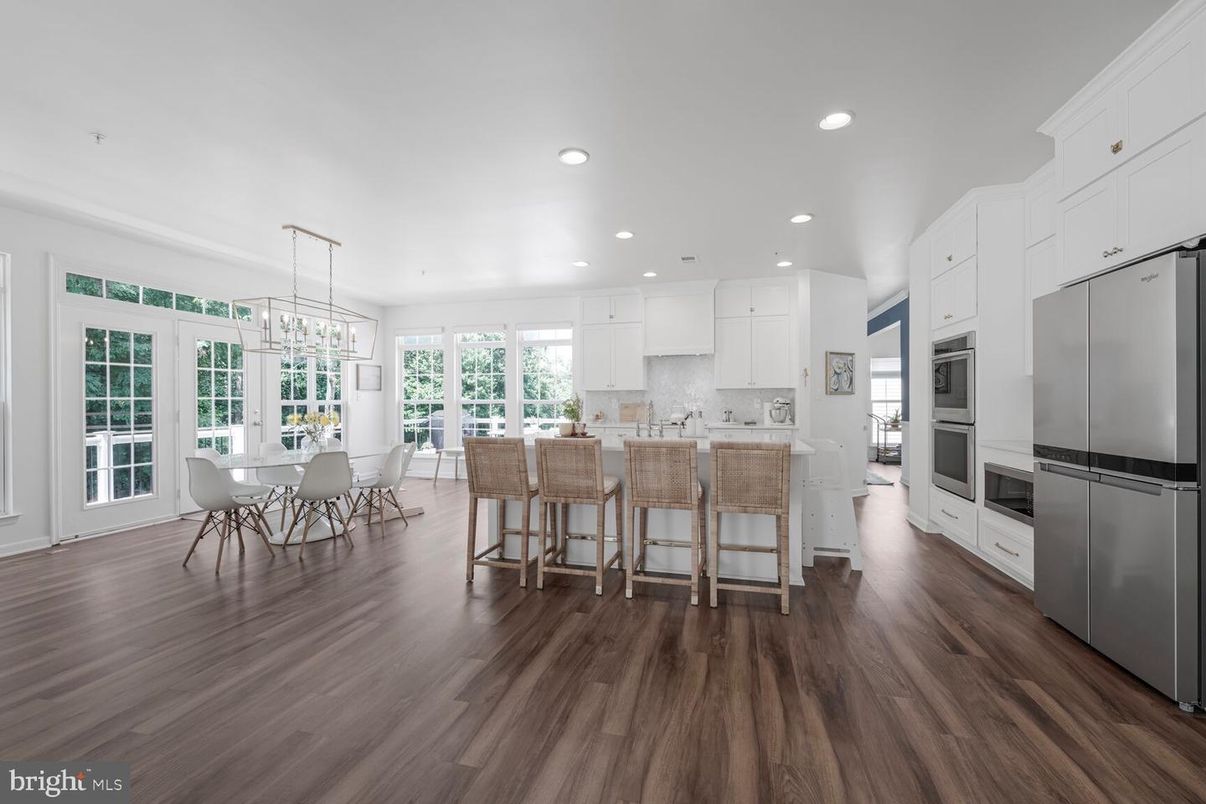 Chandelier, Dining room, Interior, Kitchen, Pendant Lights, Recessed Lighting, Stainless Steel Appliances, Wood Texture Flooring