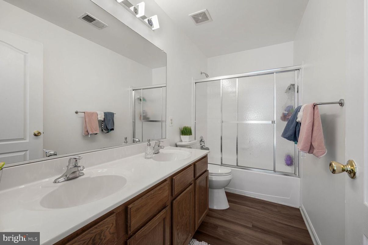 Bathroom, Dual Sink Vanities, Glass Shower, Interior, Wood Texture Flooring