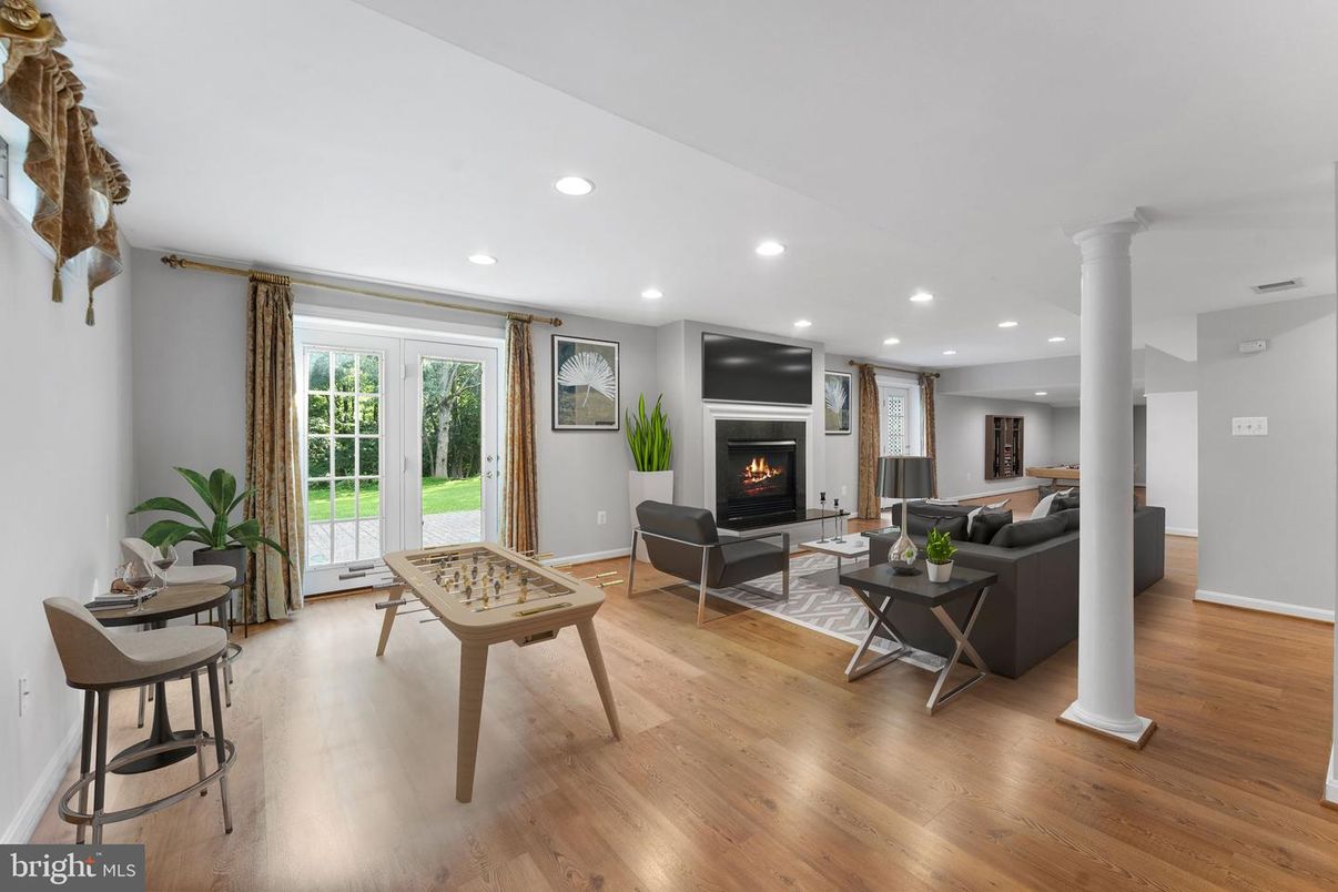 Fireplace, Game Room, Interior, Living room, Recessed Lighting, Wood Texture Flooring