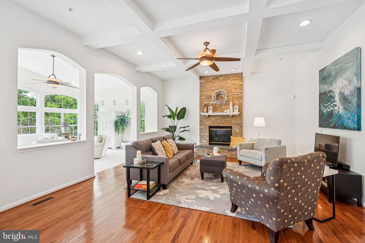 Fireplace, Interior, Living room, Recessed Lighting, Stone Walls, Wood Texture Flooring