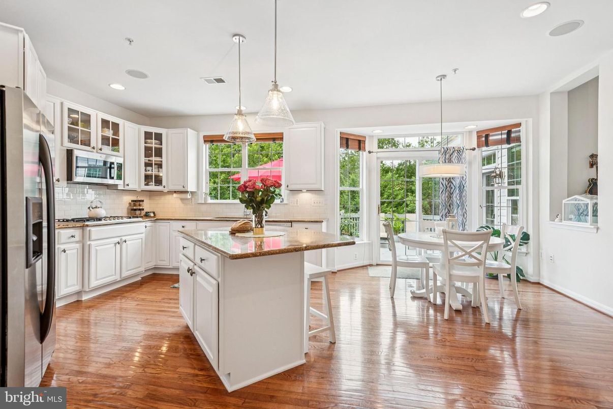 Dining room, Interior, Kitchen, Pendant Lights, Recessed Lighting, Stainless Steel Appliances, Wood Texture Flooring