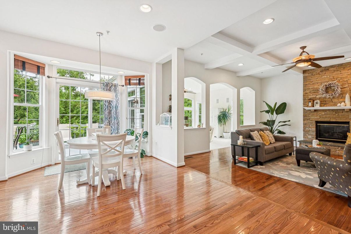 Dining room, Fireplace, Interior, Living room, Pendant Lights, Recessed Lighting, Stone Walls, Wood Texture Flooring