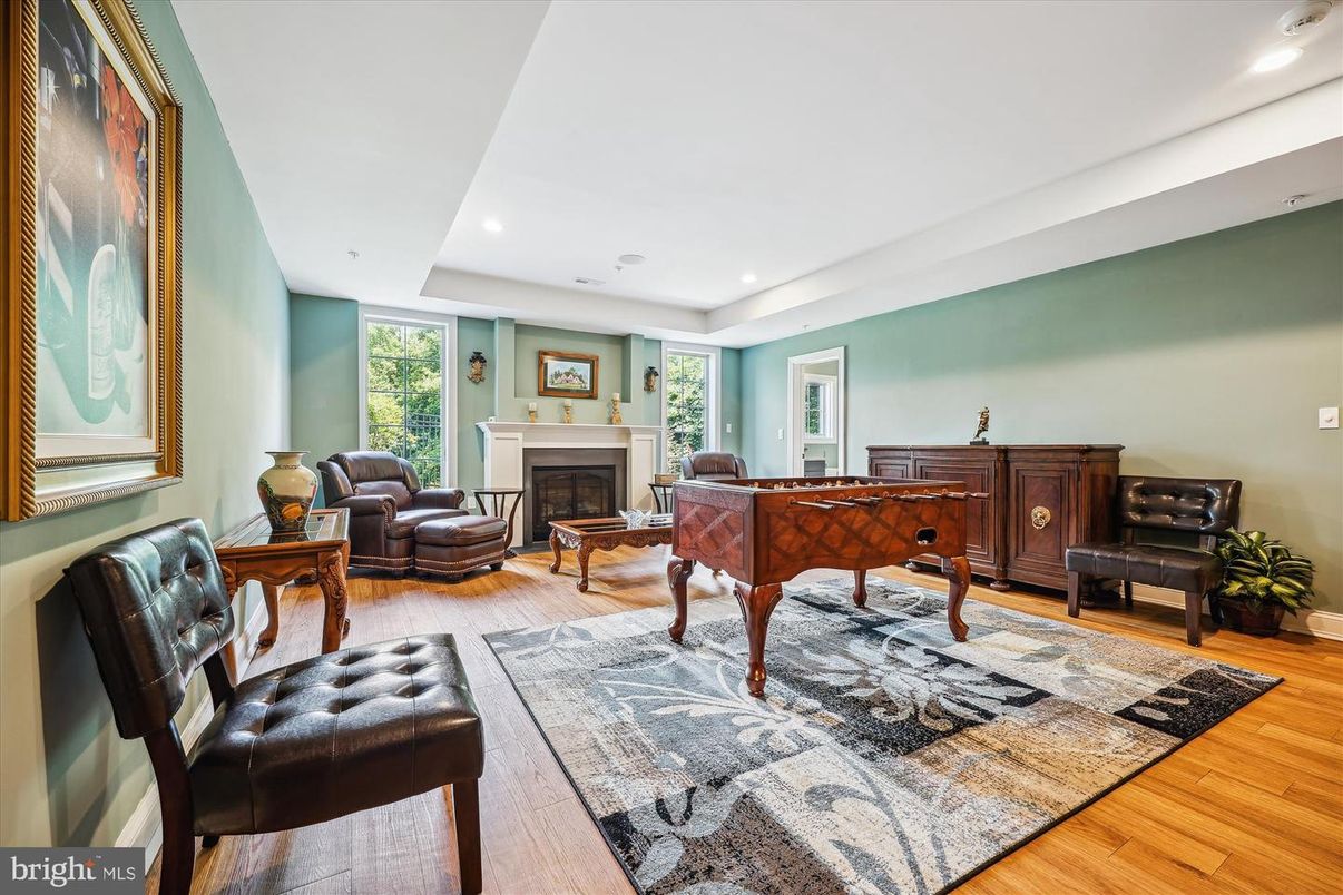 Fireplace, Game Room, Interior, Living room, Recessed Lighting, Wood Texture Flooring