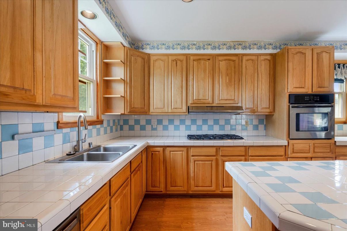 Interior, Kitchen, Recessed Lighting, Tile Countertops, Wood Texture Flooring