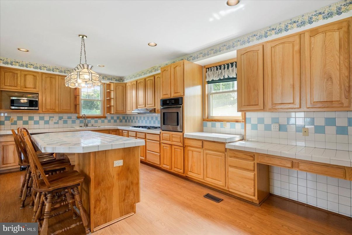 Interior, Kitchen, Pendant Lights, Recessed Lighting, Tile Countertops, Wood Texture Flooring